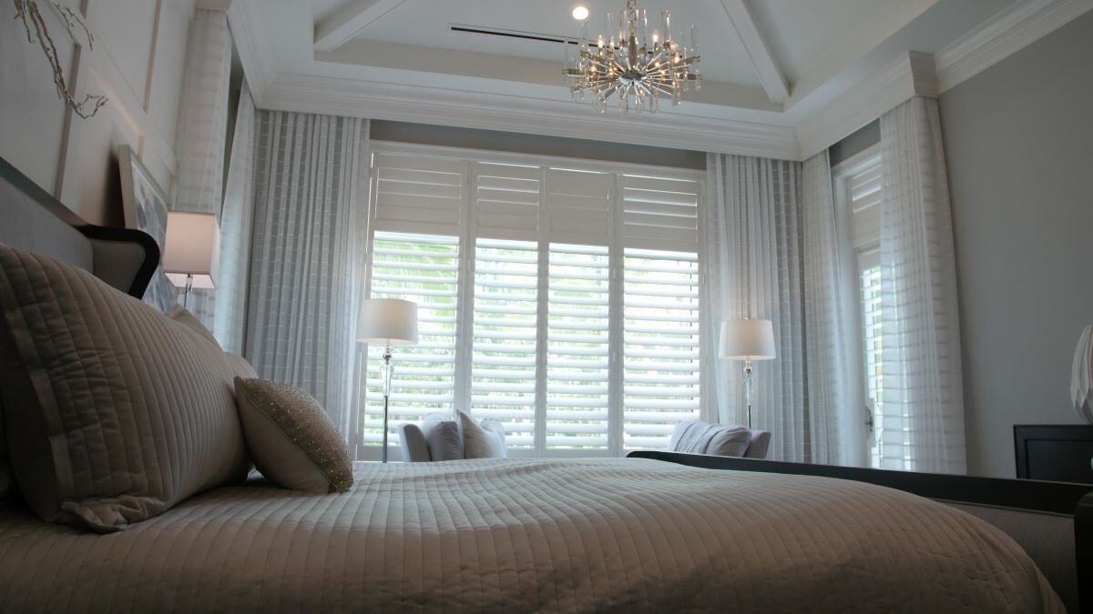 Naples Shutter white plantation shutters in bedroom